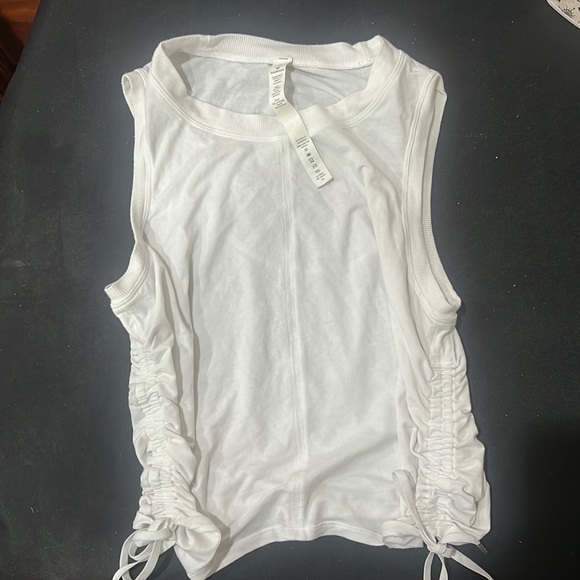 lululemon athletica Tops - This is a white, size 4, Lululemon drawstring tank top! No stains! Smoke free 🏠